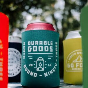 A group of coozies with the words 'diverse goods' on them.