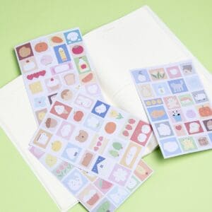 A notebook with a variety of Stickers on it.