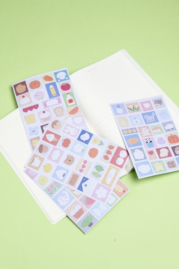 A notebook with a variety of Stickers on it.